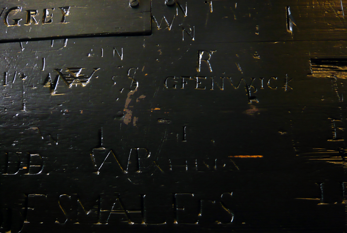 Generations of school boys have left their mark on the building by carving their names into the wooden panelling. 